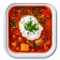 Delicious Vegetable Soup with Sour Cream and Fresh Herbs in White Square Container png