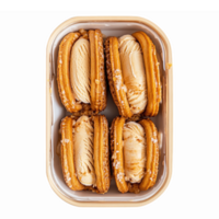 Delicious Caramel Cream-Filled Biscuits in a Container with Transparent Background png