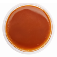 Rich Caramel Sauce in Clear Container for Baking Desserts and Flavor Enhancements png