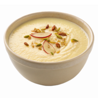 Delicious Creamy Dessert Bowl with Toppings including Nuts and Slices of Fruit png