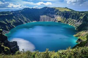 A caldera geological formation is a large, basin-like depression formed when a volcano collapses after an eruption photo