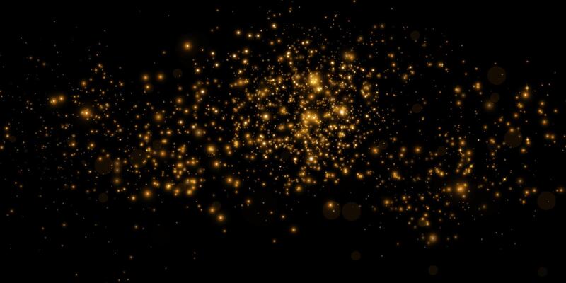 Shimmering Glittering Gold Particles Set Against a Striking Black Background Surface
