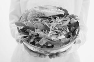 Woman Holding a Bowl of Salad, Close View Background creative background photo