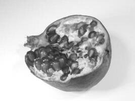 Close Up of Pomegranate Halves with Juicy Seeds for different design purposes photo