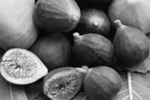 Figs on green leaves close view background creative background photo