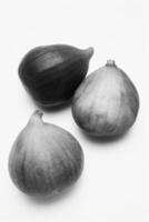 Three Figs on a Plate creative background photo