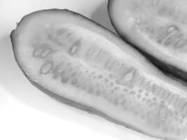 Freshly Cut Cucumber Halves Close Up for different design purposes photo