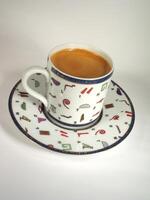 A cup of coffee on a table close view background wallpaper design photo