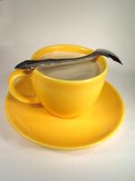 A cup of coffee on a table close view background banner photo