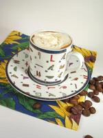 A cup of coffee on a table close view background cool wallpaper photo
