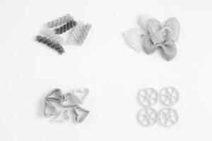 Different pasta shapes creative background photo