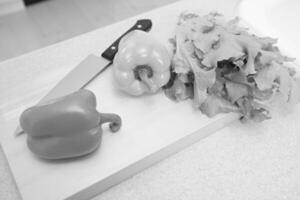 Vegetables and knife on a cutting board wallpaper photo