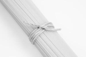 Spaghetti tied with string wallpaper photo