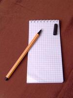 Empty notebook and a pen background creative wallpaper photo
