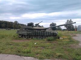 Battle Tank Parked on Field photo