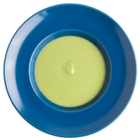 Creamy green asparagus soup in a blue plate, top view . Freshly blended asparagus soup with herbs and a drizzle of cream, isolated on a transparent background png