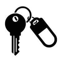 Key and keychain icon in black silhouette. Front view representation. A clean, flat illustration. Isolated against a white background. vector