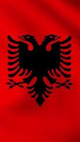 Vertical, portrait, waving national flag of Albania. Smooth animation with highly detailed, realistic animated background for social media, screens smartphone. Official colors cloth motion video