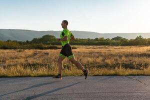 Triathlete in professional gear running early in the morning, preparing for a marathon, dedication to sport and readiness to take on the challenges of a marathon. photo
