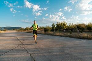 Triathlete in professional gear running early in the morning, preparing for a marathon, dedication to sport and readiness to take on the challenges of a marathon. photo
