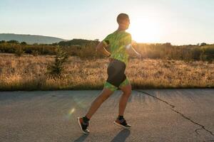 Triathlete in professional gear running early in the morning, preparing for a marathon, dedication to sport and readiness to take on the challenges of a marathon. photo