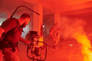A professional cameraman captures the intense moments as a group of skilled soldiers embarks on a dangerous mission inside an abandoned building, their actions filled with suspense and bravery photo
