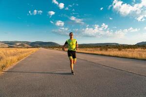 Triathlete in professional gear running early in the morning, preparing for a marathon, dedication to sport and readiness to take on the challenges of a marathon. photo