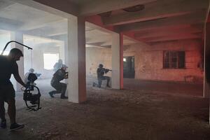 A professional cameraman captures the intense moments as a group of skilled soldiers embarks on a dangerous mission inside an abandoned building, their actions filled with suspense and bravery photo