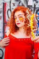 Portrait of a girl with a fiery make-up with candle photo