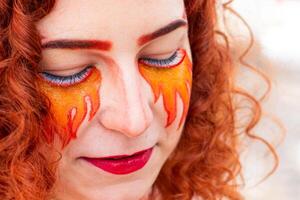 a Portrait of a girl with a fiery make-up photo