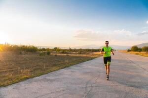 Triathlete in professional gear running early in the morning, preparing for a marathon, dedication to sport and readiness to take on the challenges of a marathon. photo