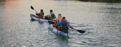 A group of friends enjoying having fun and kayaking while exploring the calm river, surrounding forest and large natural river canyons photo