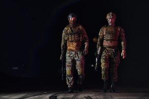 Two professional soldiers marching through the dark of night on a dangerous mission, epitomizing their unwavering bravery, unwavering teamwork, and the high-stakes intensity of their specialized photo