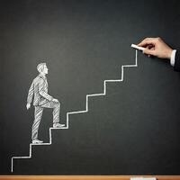 Businessman climbing up stairs to success concept photo