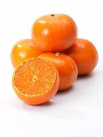 pile of oranges, showcasing various types such as mandarin oranges, valencia oranges, and clementines. These fruits are part of the citrus family and are known for their vibrant color photo