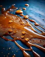 Liquid Caramel Flowing Over a Wooden Surface Creating a Glossy Texture and Vibrant Color photo