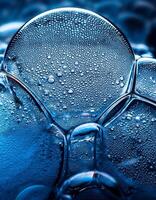 Bubbles and Droplets Create a Mesmerizing Pattern in Vibrant Blue Liquid photo