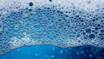 Bubbles Floating on a Surface of Blue Liquid Create a Captivating Visual Effect in a Close-Up View photo