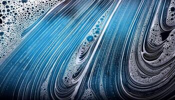 Vibrant Patterns of Blue and White Soap Foam Swirling Together in an Artistic Display photo