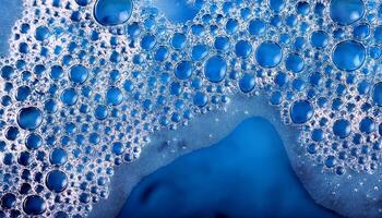Water Droplets Cluster on a Smooth Surface Creating a Textured and Vibrant Blue Background photo