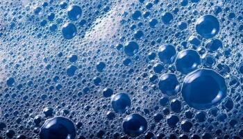 Colorful Blue Bubbles Create Interesting Patterns on a Surface of Foam at a Close Range During a Bright Moment photo