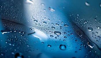 Raindrops Create Beautiful Patterns on a Blue Surface During a Rainy Day photo