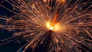 Sparkler Ignites to Create a Dazzling Display of Light During Festive Celebrations at Night photo