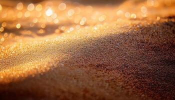 Golden Sand Glimmers Under Warm Sunlight at a Beach in Late Afternoon photo
