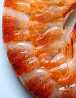 Close-up View of Cooked Shrimp Showcasing Vibrant Orange Color and Detailed Texture photo