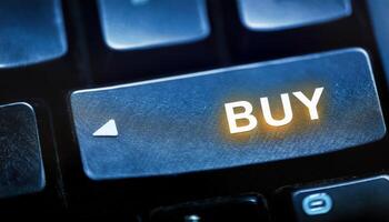 Close-up of a Computer Keyboard Highlighting the Buy Key Demonstrating Online Shopping Convenience photo