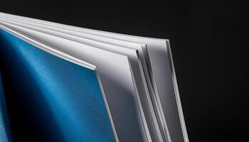 Close-up View of an Open Book Showcasing Its Blank Pages and Colorful Cover photo