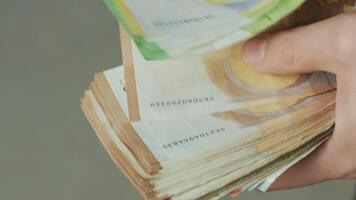 Men's hands quickly count banknotes. Businessman counts banknotes of euro in hands. video