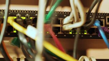Network switch and ethernet cable in rack cabinet. Network connection technology and has a status LED to show working status. Concept of infrastructure with cables connected to data center 13 video