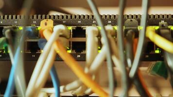 Network switch and ethernet cable in rack cabinet. Network connection technology and has a status LED to show working status. Concept of infrastructure with cables connected to data center 8 video
